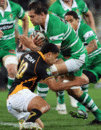 Manawatu's Reece Robinson is tackled by Wellington's Lima Sopoaga