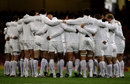 England's players form a huddle ahead of kick-off