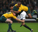 South Africa's Jaque Fourie is set upon by the Wallabies