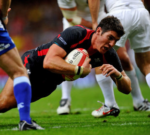 Wales' James Hook crosses for a try