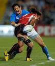 Italy's Alessandro Zanni is tackled by Japan's Ryukoliniasi Holani
