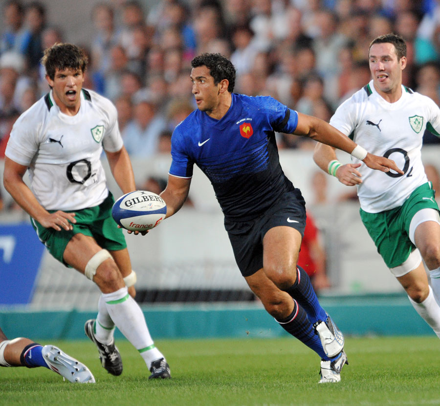 France centre Maxime Mermoz launches a counter-attack