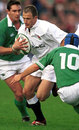 England's Mike Catt takes on the Ireland defence