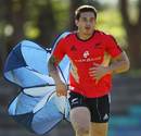 All Blacks centre Sonny Bill Williams tows a wind parachute during training