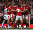 Wales wing George North is congratulated after his try