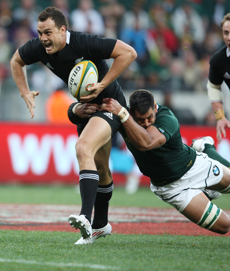 South Africa's Pierre Spies tackles New Zealand's Israel Dagg
