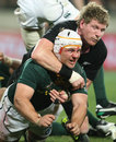 New Zealand's Adam Thomson gets to grips with South Africa's Heinrich Brussow