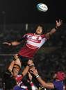 Japan's Takashi Kikutani reaches for the ball