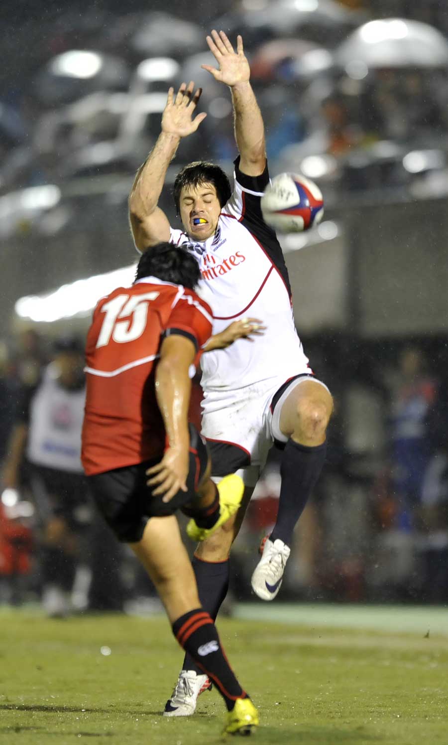 US Eagles' James Paterson tries to block the ball kicked by Japan's Taihei Ueda 