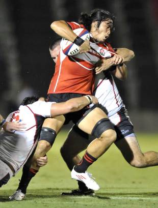 Japan's Itaru Taniguchi is tackled by a wall of US Eagles defenders, Japan v US Eagles, Prince Chichibu Memorial Rugby Ground, Tokyo, Japan, August 21, 2011