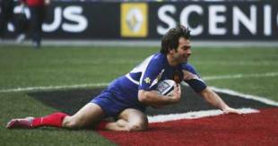 France winger Christophe Dominici crosses to score for France during their 31-6 win over England, France v England, Six Nations, Stade de France, March 12 2006.