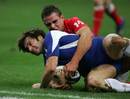Christophe Dominici scores a try against Wales