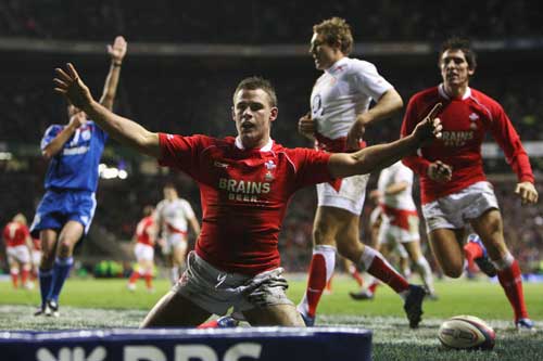 Lee Byrne celebrates his try against England