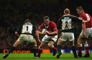 Munster captain Mick Galwey charges at front-row pair Graham Rowntree and Dorian West of Leicester, Leicester Tigers v Munster, Heineken Cup final, Millennium Stadium, May 25 2002.