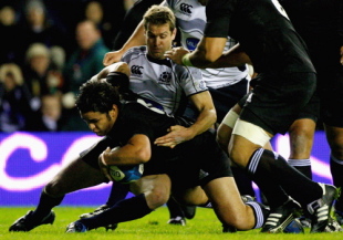 Chris Paterson of Scotland tackles Piri Weepu of New Zealand as he scores a try during the Autum Test at Murrayfield stadium on November 8, 2008 in Edinburgh, Scotland.