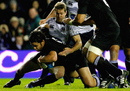Chris Paterson of Scotland tackles Piri Weepu of New Zealand as he scores a try 