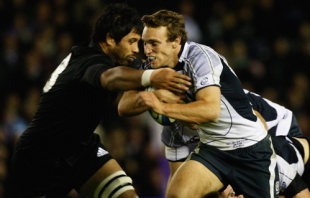 Mike Blair of Scotland tackles Liam Messam of New Zealand during the Autumn Test at Murrayfield stadium on November 8, 2008 in Edinburgh, Scotland.