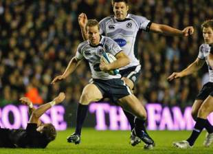 Chris Paterson of Scotland is tackled Andy Ellis of New Zealand during the Autum Test at Murrayfield stadium in Edinburgh, Scotland on November 8, 2008. 