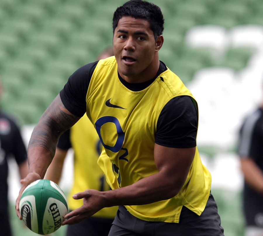 England's Manu Tuilagi looks for support