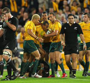 Wallabies scrum-half Will Genia is congratulated after his try, Australia v New Zealand, Tri-Nations, Lang Park, Brisbane, Australia, August 27, 2011