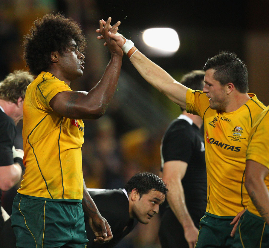 Wallabies No.8 Radike Samo is congratulated after his try