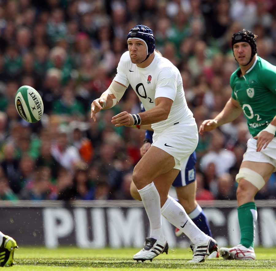 England's James Haskell looks to shift the ball