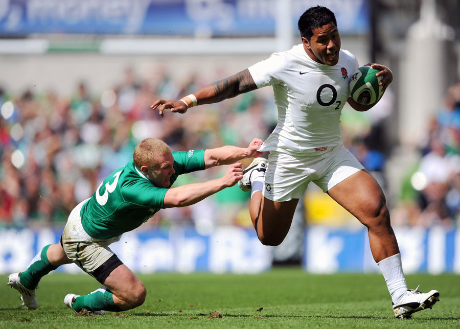 England centre Manu Tuilagi shrugs off a tackle by Keith Earls
