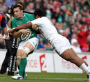 Ireland flanker David Wallace is tackled by Manu Tuilagi