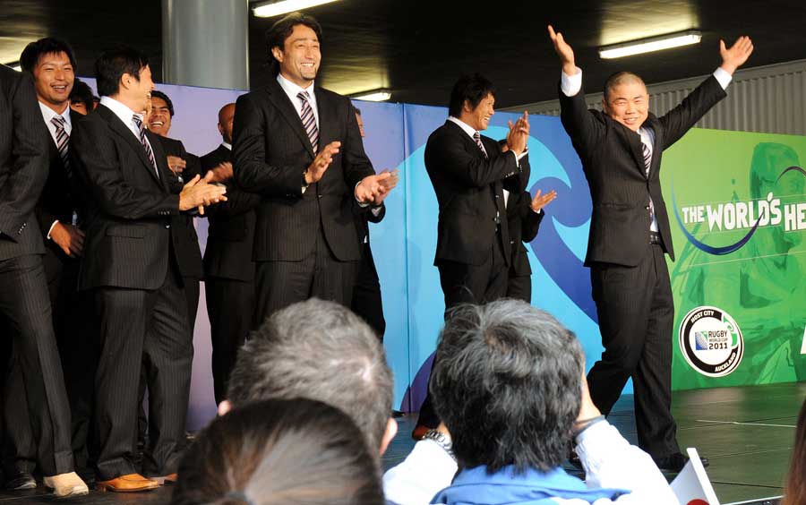 Japan's Fumiaki Tanaka dances as his team arrive in Auckland