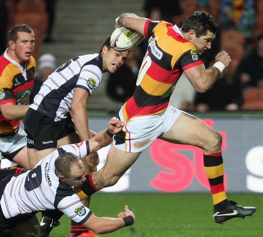 Waikato's Stephen Donald stretches the Canterbury defence