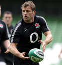 England wing Mark Cueto passes the ball during training