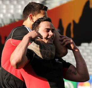 All Blacks winger Zac Guildford is wrapped up by Sonny Bill Williams, Captain's Run, Eden Park, Auckland, September 8, 2011
