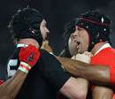 The All Blacks' Ali Williams gets up close and personal with Tonga's Joseph Tuineau