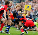 Bath's Tom Biggs is tackled by Alex Goode