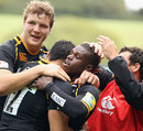Wasps wing Christian Wade is congratulated after his try