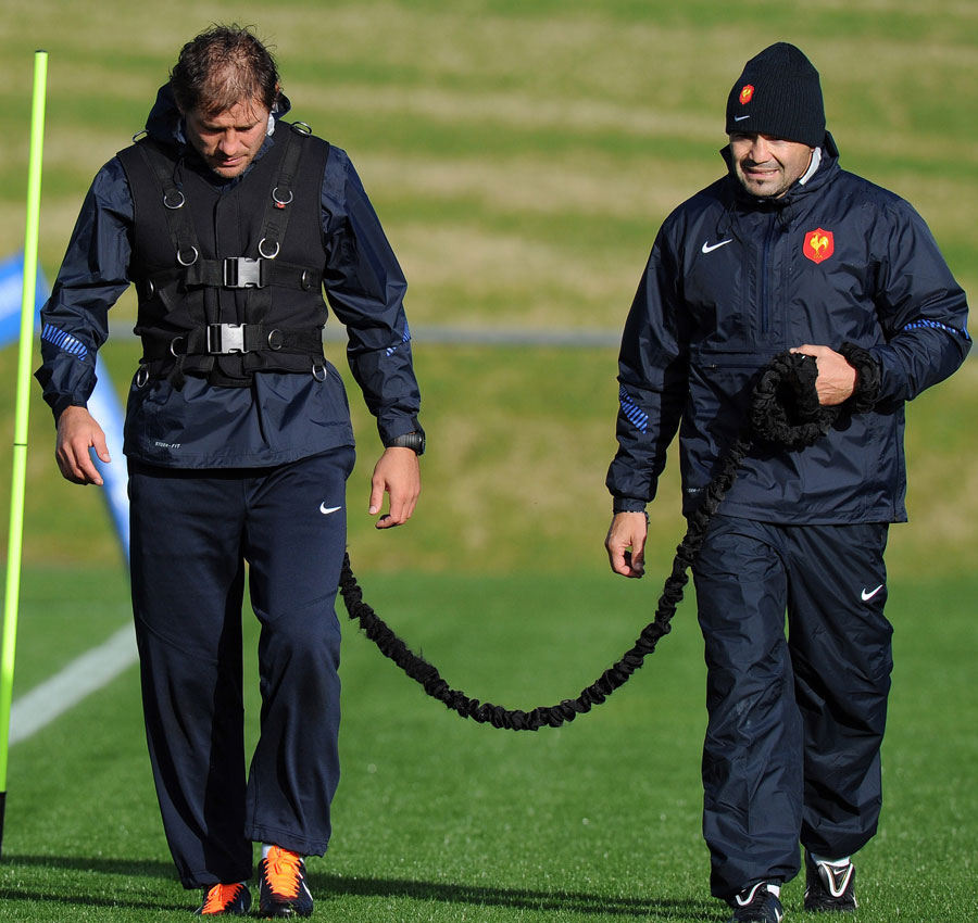 France wing Cederic Heymans is kept on a tight leash by fitness assistant Laurent Arbo