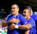 Samoa scrum-half Kahn Fotuali'i celebrates his try