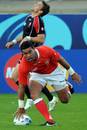 Tonga's Siale Piutau dots the ball down
