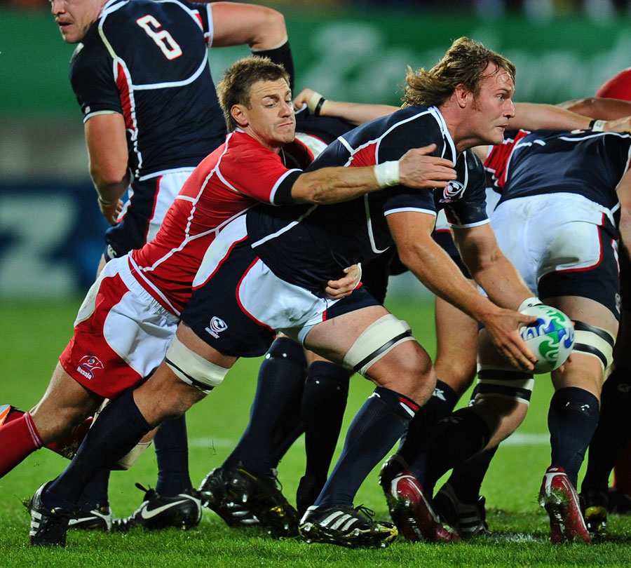 The United States' Nic Johnson looks to get the ball away under pressure