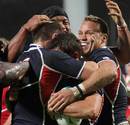 The USA celebrate their try against Russia in the Pool C clash