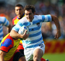 Argentina's Santiago Fernandez bursts through to score the opening try
