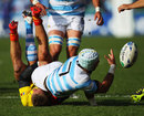 Argentina's Juan Manuel Leguizamon offloads the ball in the tackle