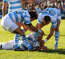 Argentina's Genro Fessia is congratulated on a try