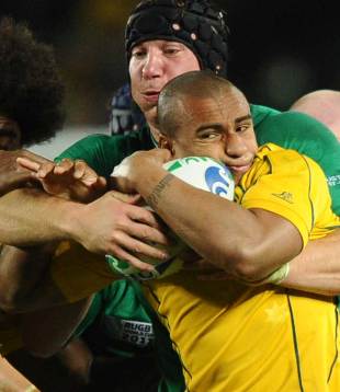 Australia's Will Genia is pushed back by Ireland's Stephen Ferris, Australia v Ireland, Rugby World Cup, Eden Park, Auckland, New Zealand, September 17, 2011