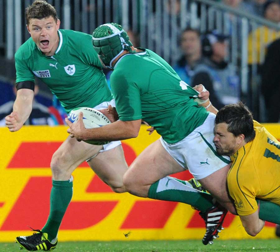 Ireland's Rory Best tries to get the ball away to Brian O'Driscoll