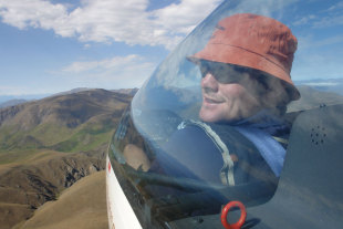 All Blacks captain Richie McCaw at the controls of a glider soaring over Omarama