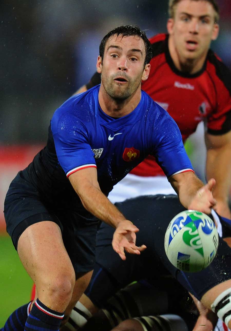 France's Morgan Parra looks to shift the ball