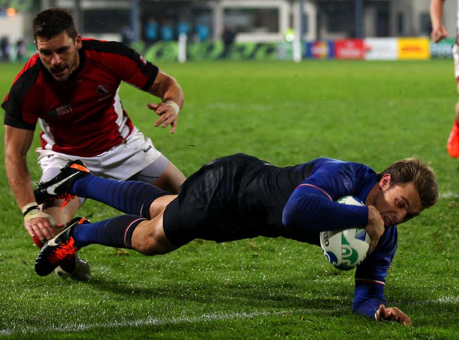 France's Vincent Clerc dives over for one of his three scores