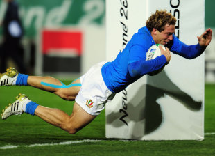 Italy's Giulio Toniolatti dives in to score his second try