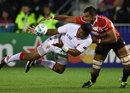 Japan flanker Michael Leitch tackles Tonga's Taufa'ao Filise 